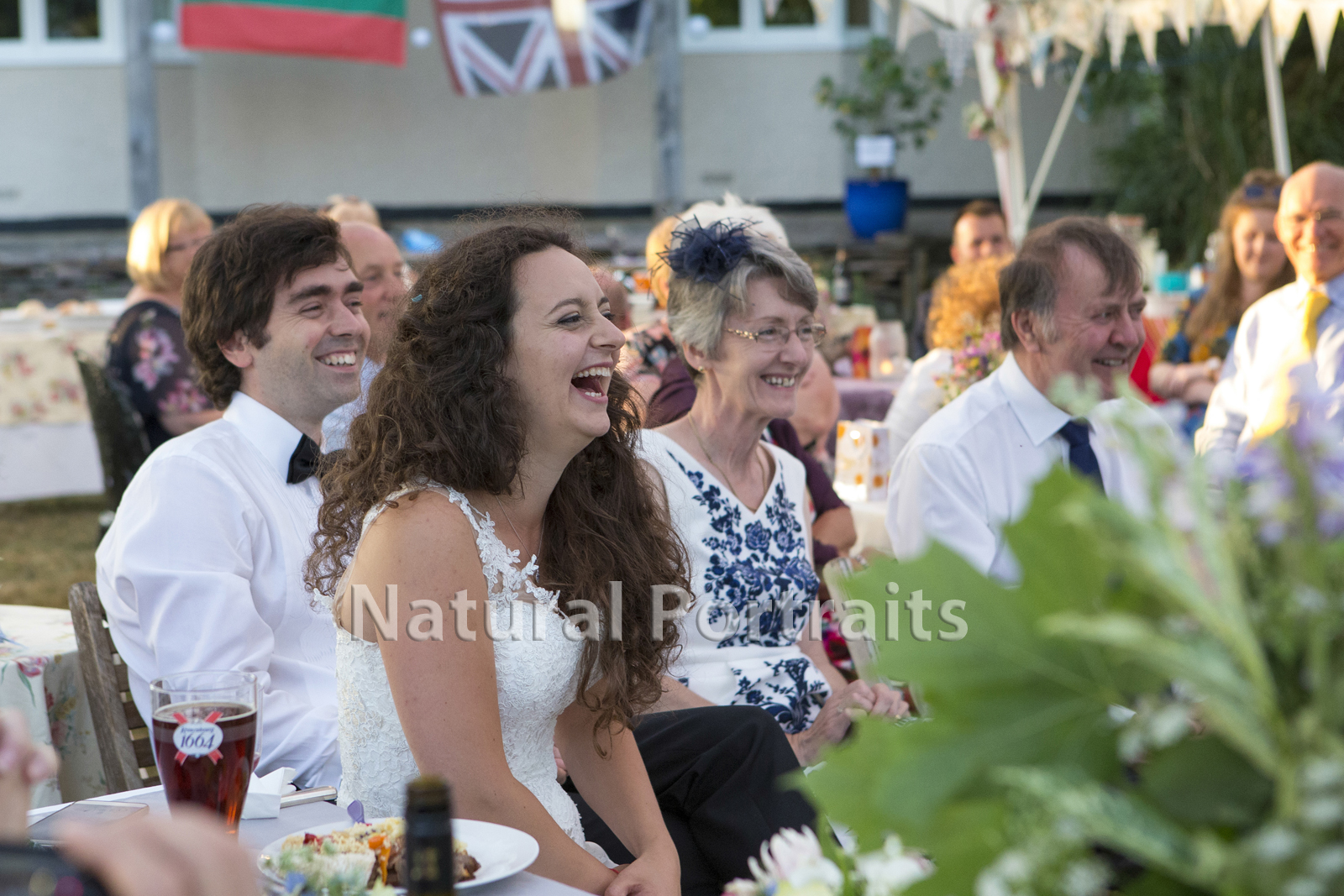 guests laughing at wedding